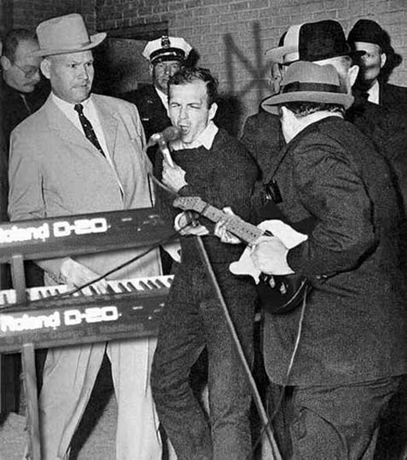 Lee Harvey Oswald rocks the mike
