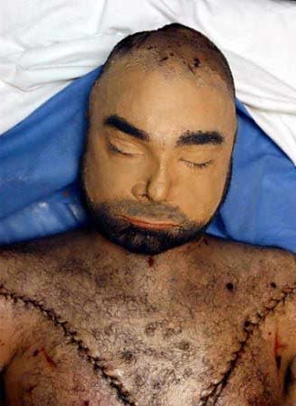 Uday Hussein with reconstructed face in Air Force morgue