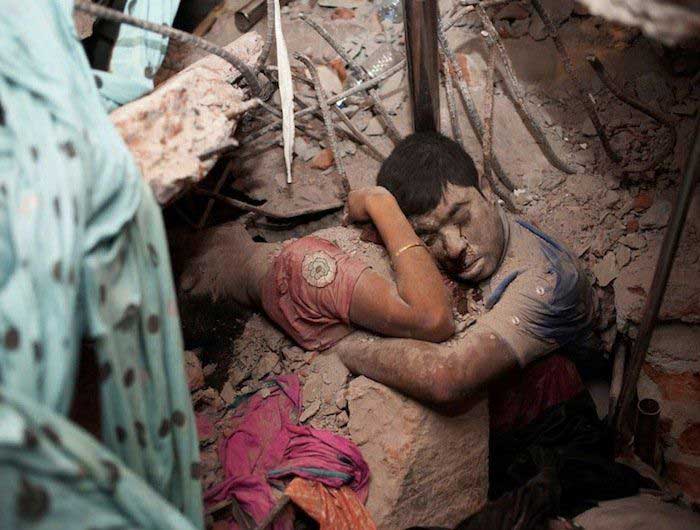 Victims of a building collapse embracing each other